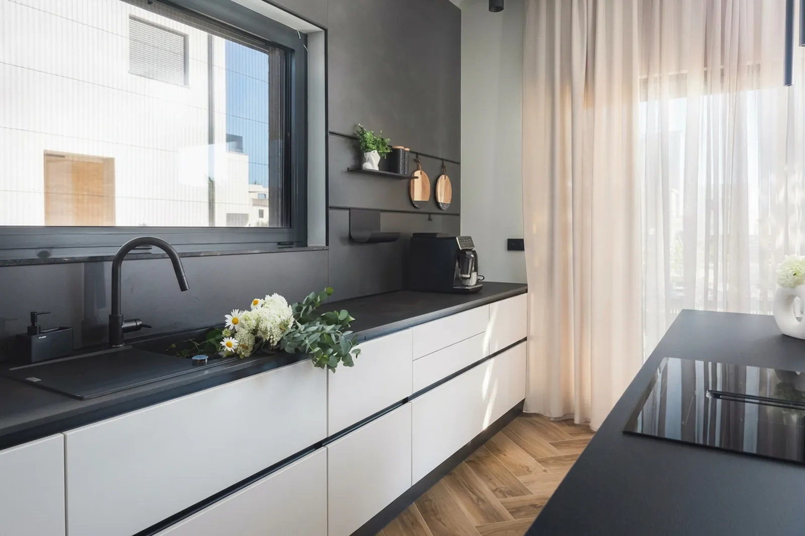 Kitchen counter with sink and fresh flowers