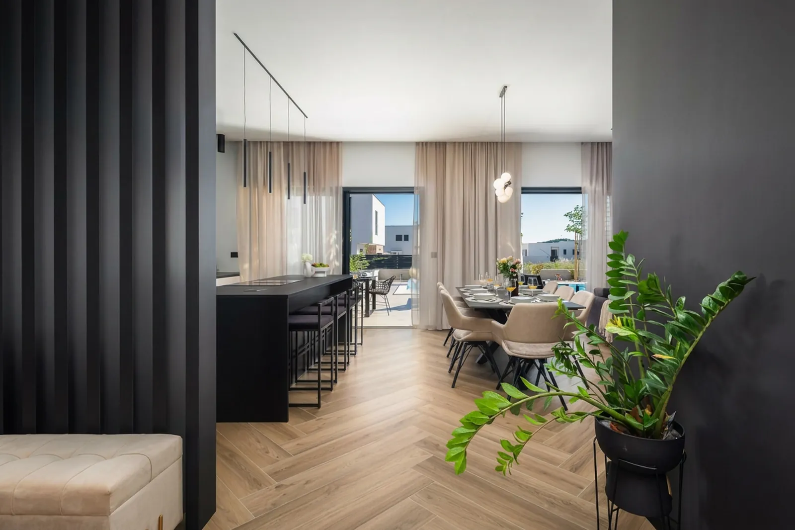 Living-to-dining flow along the herringbone floor