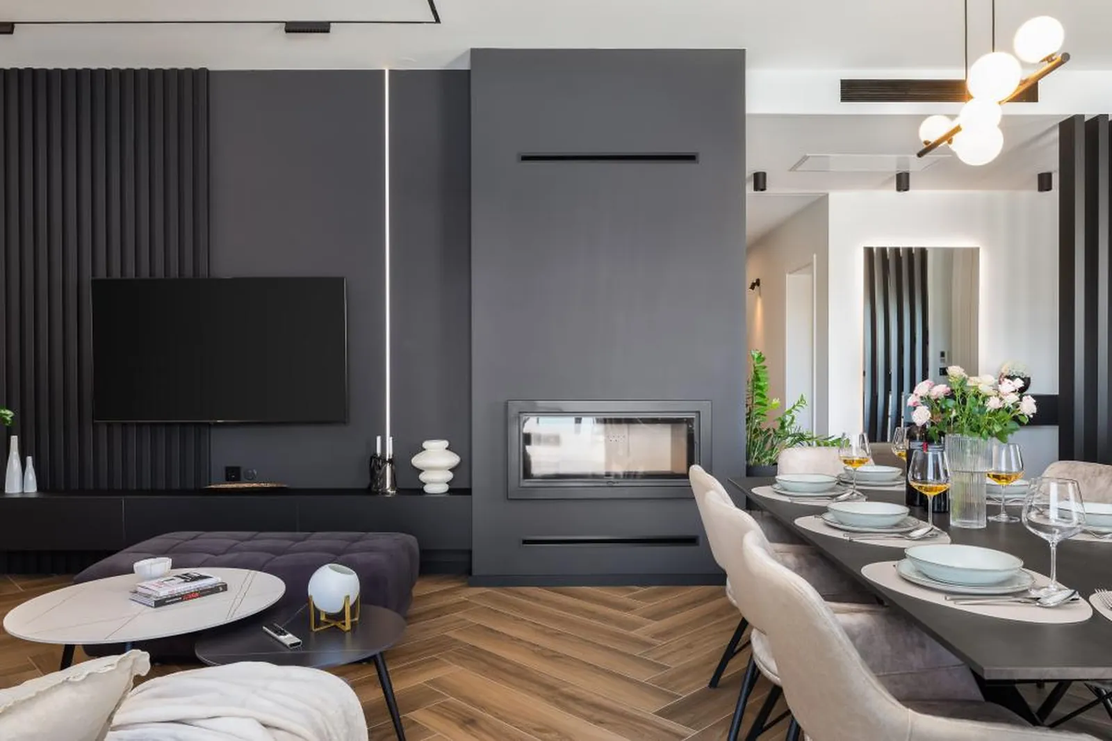 Lounge with media console open to the dining table