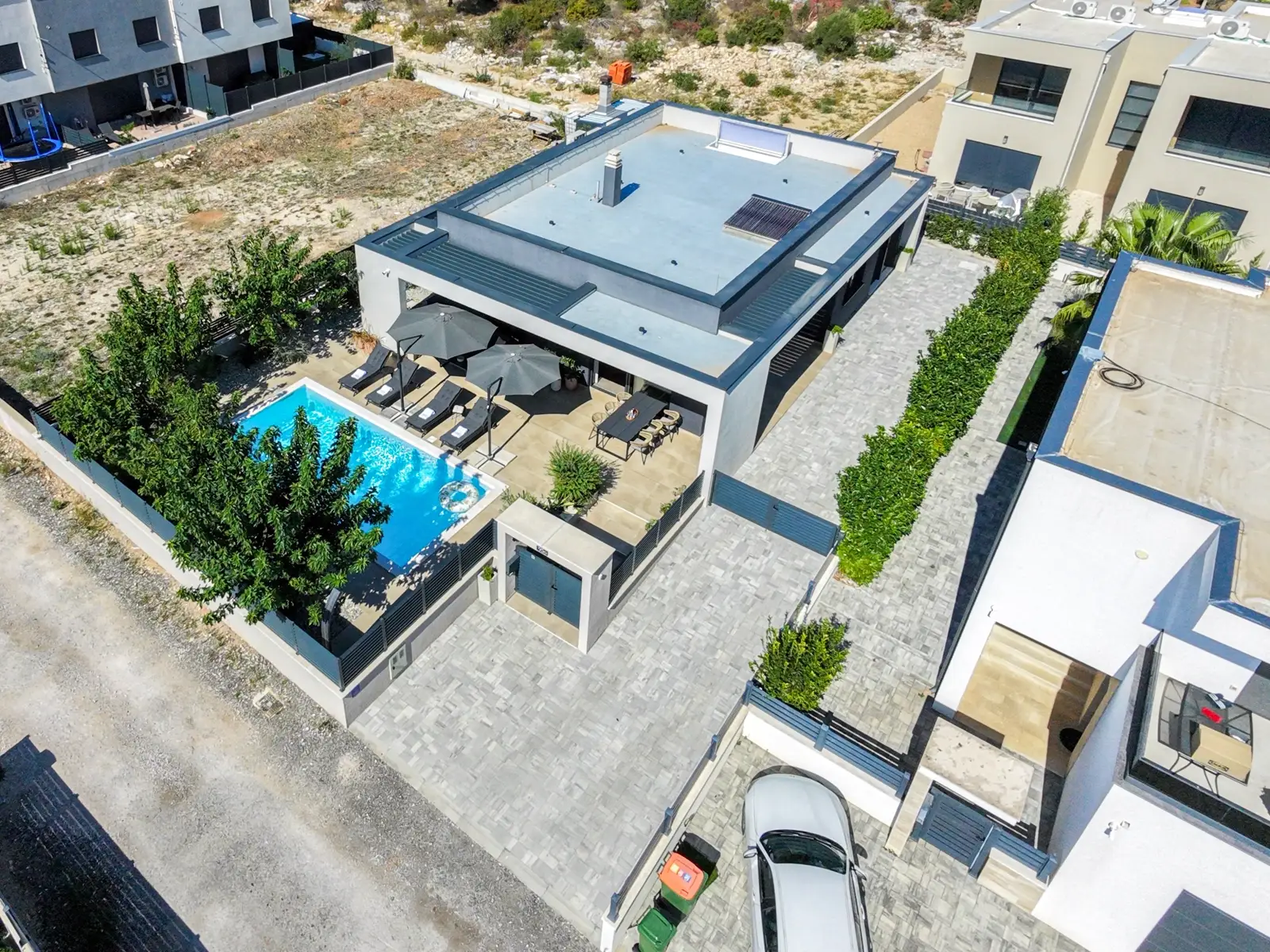 Aerial view framing Villa M and its grounds