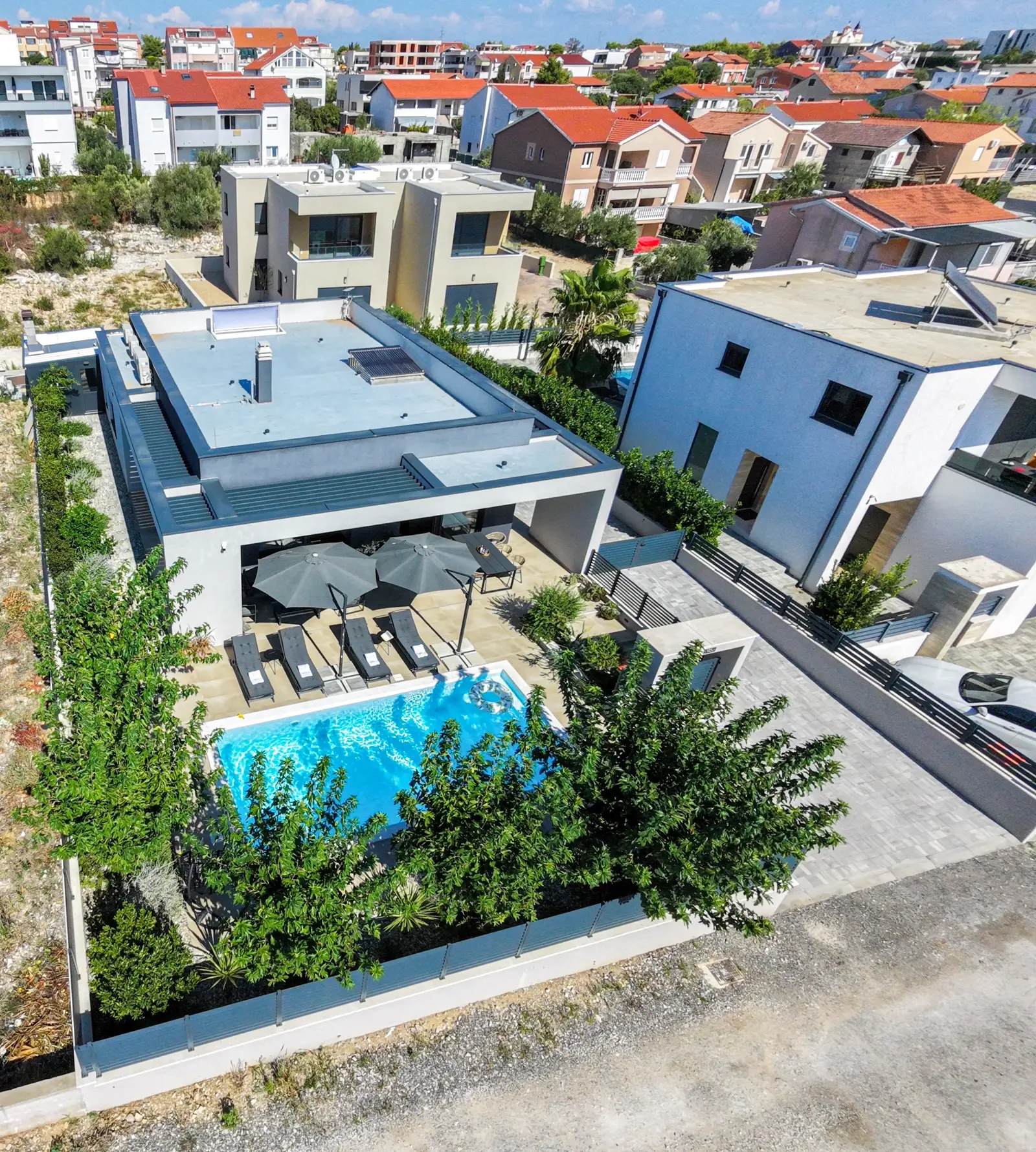 Cropped aerial of Villa M and the garden
